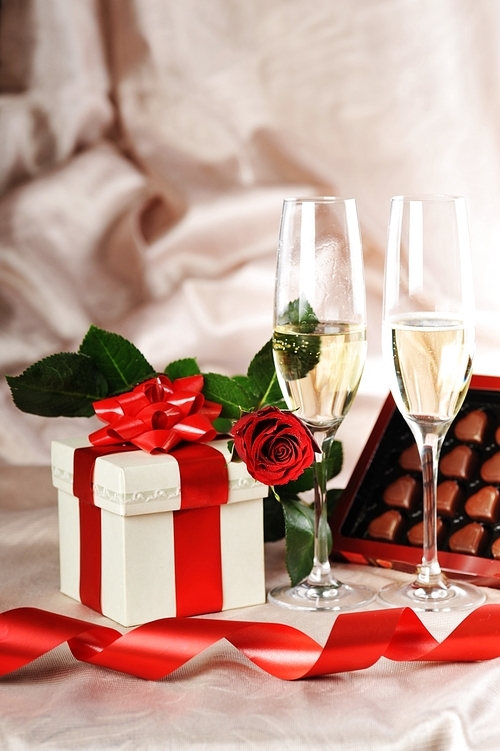 gift in box|champagne and red rose close-up