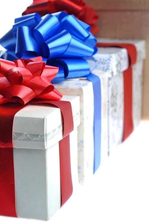 packed gifts stand on white surface