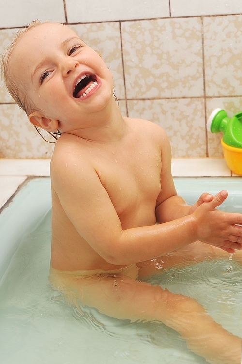 small pretty girl taking bath