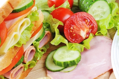 Fresh sandwich and tasty salad  on plate|close up