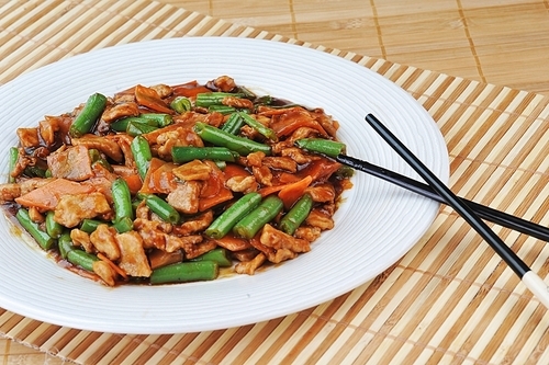 chinese cuisine. deep fried chicken with red sauce and beans