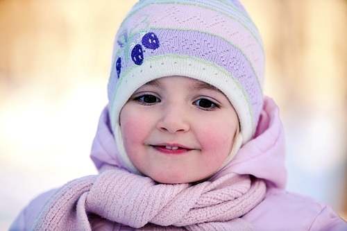 Happy little girl in winter. portrait