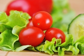 ripe and juicy cherry tomatoes and lettuce