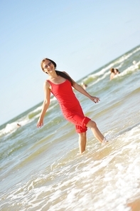 young pretty woman having fun at the sea