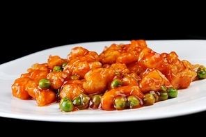 deep fried chicken with red sauce. chinese cuisine