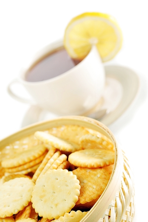 cup of tea with lemon|pastry  and  cookies in  basket