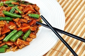chinese cuisine. deep fried chicken with red sauce and beans