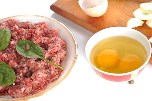 Ingredients for  homemade cutlet|ground beef|onion|eggs and garlic.