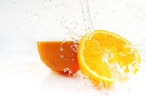 water splashes on cuted orange