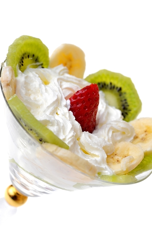 fresh chopped strawberries|kiwi and banana with whipped cream in glasswares