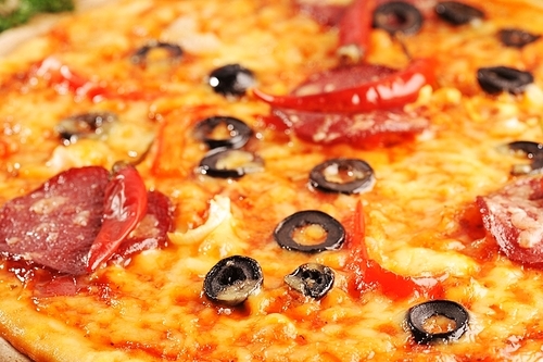 Close up of  pizza with tomatoes|cheese|black olives and  peppers