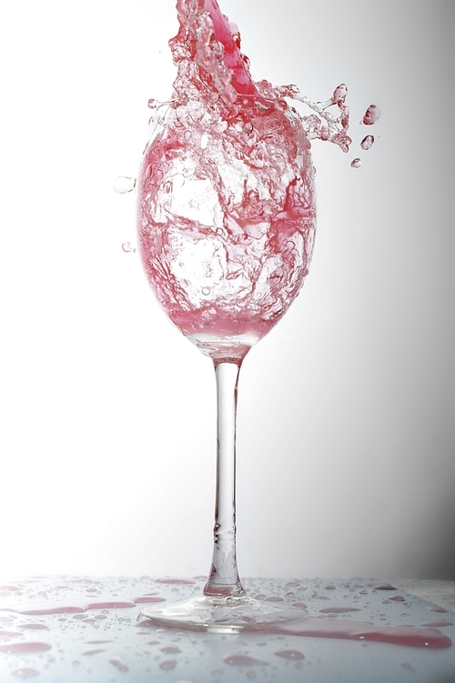 pouring liquid into  wineglass
