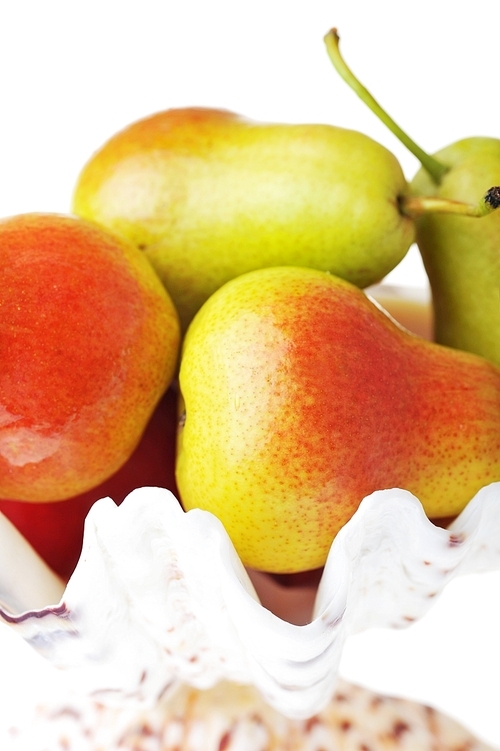 Ripe tasty red-yellow pears  in white vase