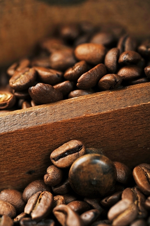 coffee beans in  box from  old hand grinder