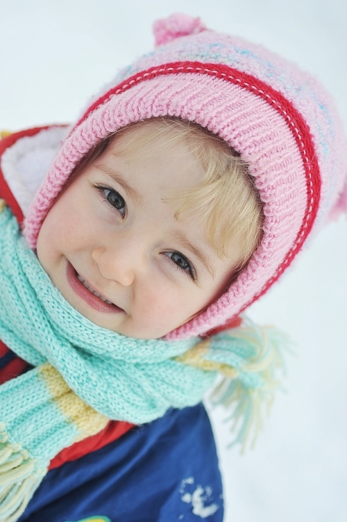 Happy little girl in winter portrait