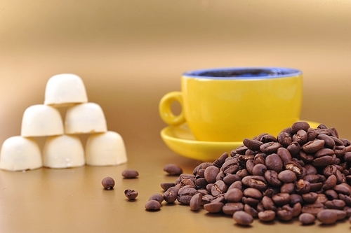 coffee beans and yellow cup