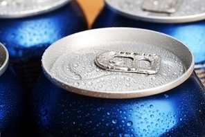 wet aluminium can with drink|close-up of top
