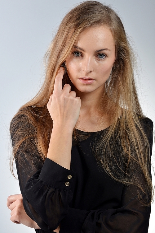 Portrait of attractive young woman with long blond hair