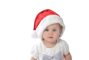 baby girl wearing santa hat on white isolated background