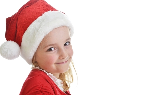 little girl in red santa hat on white background. portrait