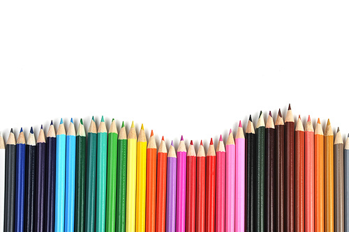 Colored pencils lined up in  row