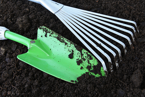 Gardening tools on organic soil