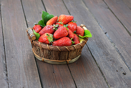 fresh and tasty strawberry in wicker basket