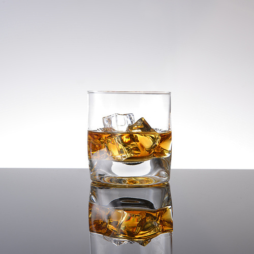 Whiskey with ice in simple glass