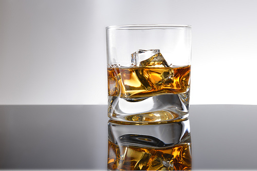 Whiskey with ice in simple glass