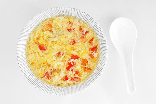 bowl  with delicious egg soup . Chinese cuisine