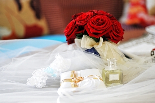 Garter|roses|perfume  and wedding rings