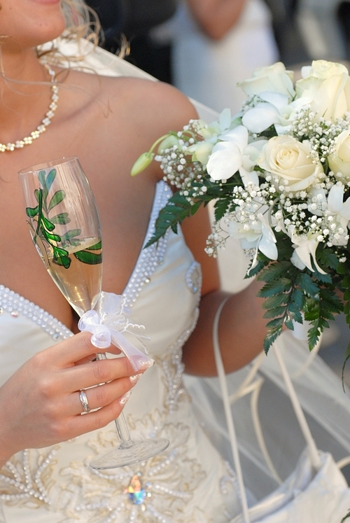 bride wearing wedding dress and  holding bouquet