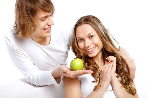 Portrait of young happy couple at home