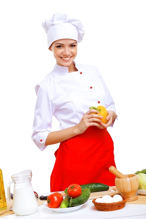 Young cook preparing food wearing apron