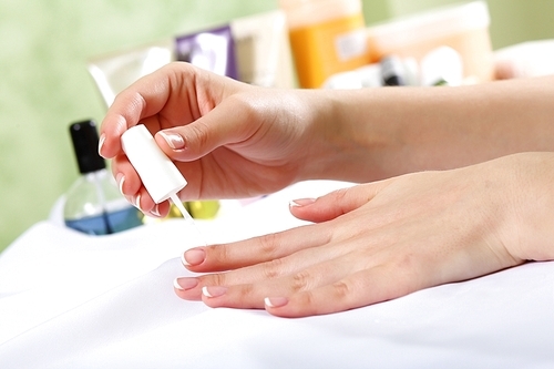 Female hands and manicure related objects in spa salon