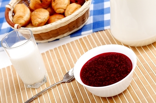 Continental breakfast with croisant and glass of milk