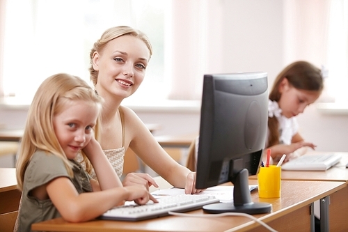 Little girl sitting and studying at school class