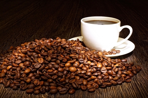 Image of coffee beans and white cup