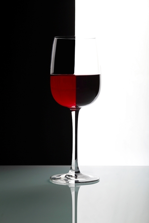 Glasses with wine on the color background