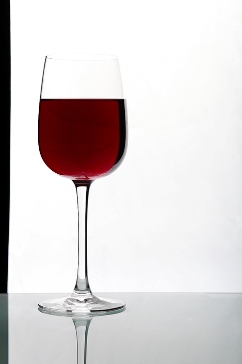 Glasses with wine on the color background