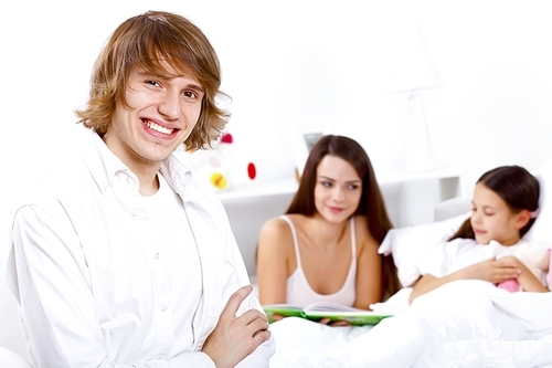 Young family with little daughter at home together