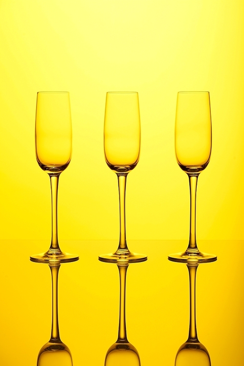 Glasses with wine on the color background