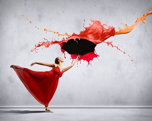 dance dancer in flying satin dress with umbrella under the paint