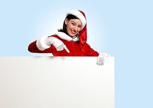 Portrait of a santa girl with a blank banner