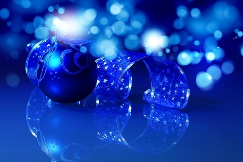 Blue Christmas collage. Decorations and ribbons on a blue background