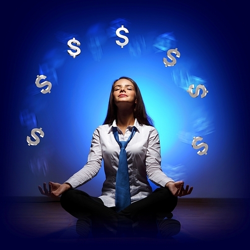 Businesswoman with financial symbols around her on the background