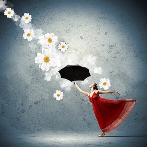 dance dancer in flying satin dress with umbrella and flowers