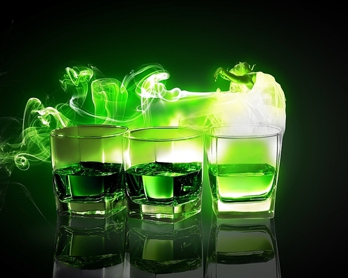 Three glasses of green absinth with fairy