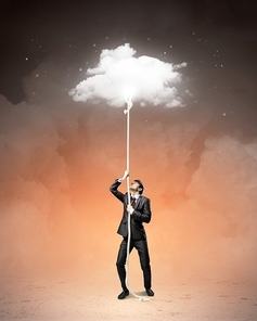 Image of businessman climbing rope attached to cloud