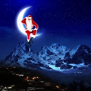 photo of santa claus sitting on the moon with a city and mountains below